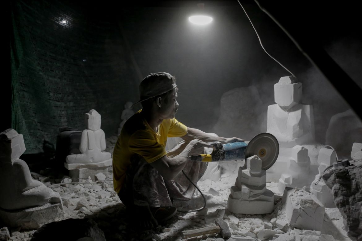 A marble carver carves a statue at his workshop in Sagyin, Mandalay, Myanmar, February 13, 2019. REUTERS/Ann Wang SEARCH "SAGYIN MARBLE" FOR THIS STORY. SEARCH "WIDER IMAGE" FOR ALL STORIES.