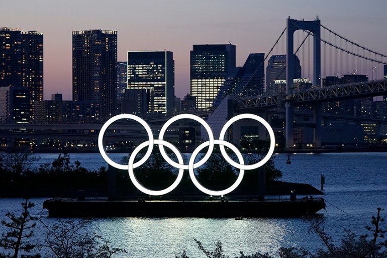 epa08389035 (FILE) - A giant Olympic rings monument is illuminated at dusk at Odaiba Marine Park in Tokyo, Japan, 25 March 2020 (issued 28 April 2020). According to local media reports, during an inte