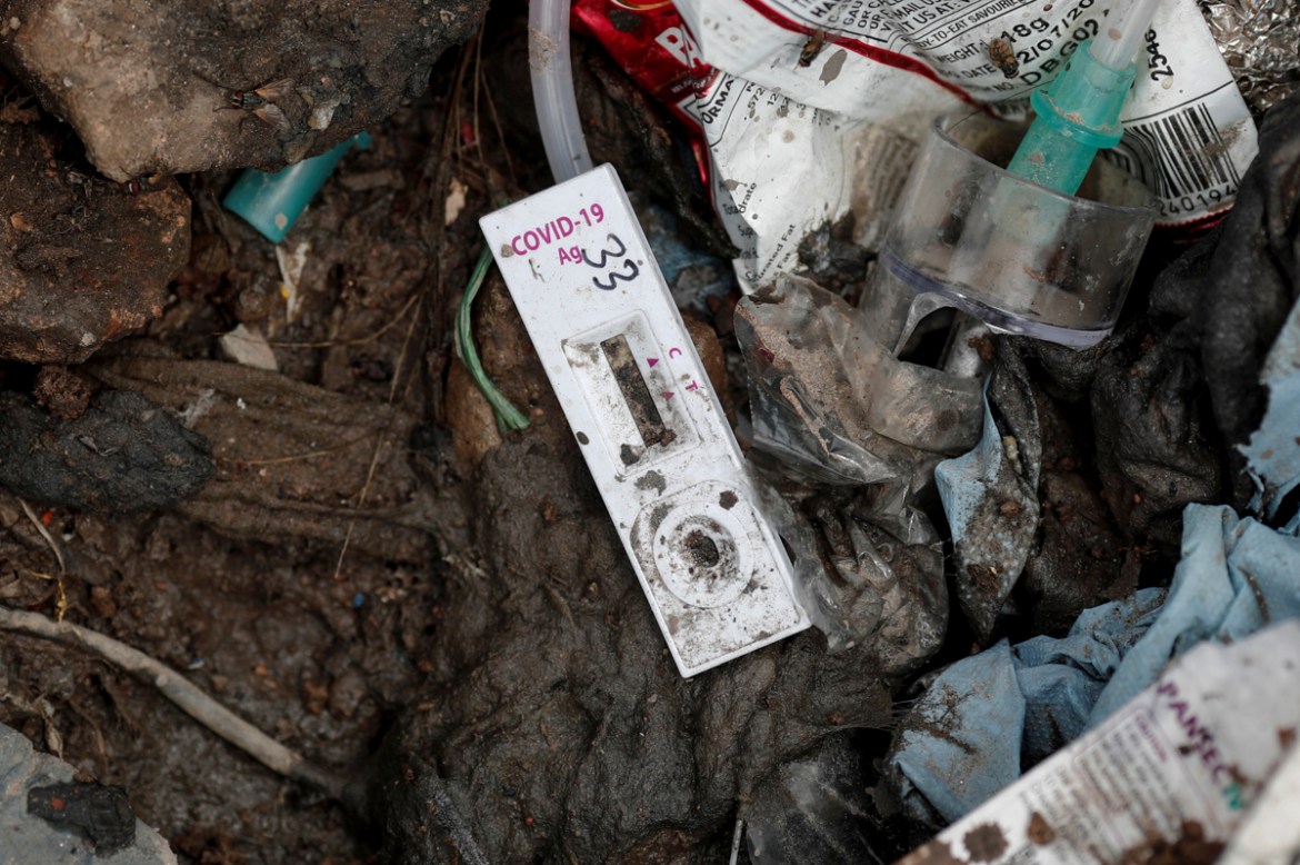A COVID-19 testing kit lies on the floor at a landfill site, during the coronavirus disease (COVID-19) outbreak, in New Delhi, India, July 22, 2020. REUTERS/Adnan Abidi SEARCH "COVID-19 MEDICAL WA