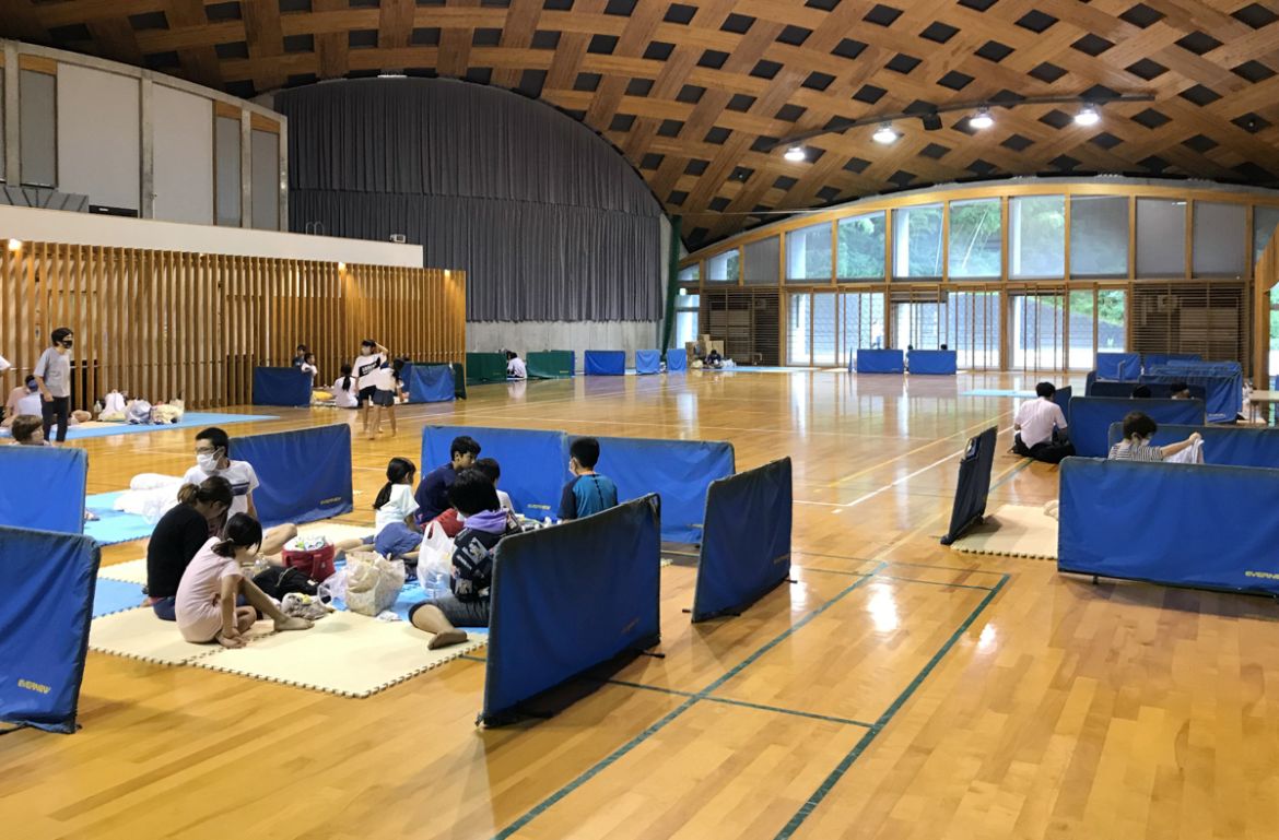 epa08529884 Local residents gather in a shelter at a gymnasium in Ashikita, Kumamoto prefecture, Japan, 06 July 2020. According to latest madia reports, 39 people are feared to have died and at least