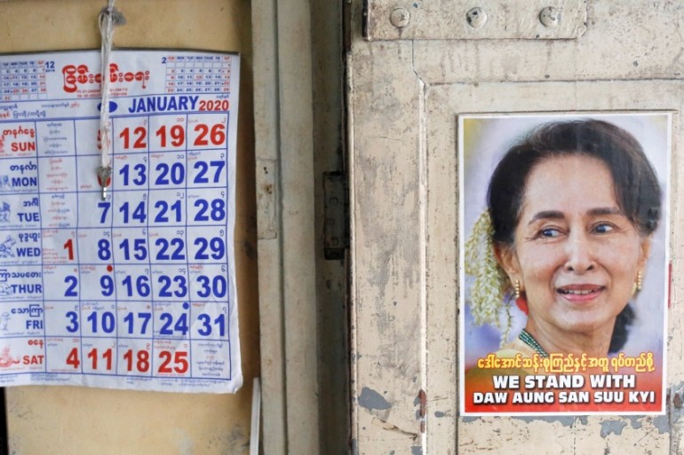 FILE PHOTO: A poster supporting Myanmar State Counselor Aung San Suu Kyi is seen in a shop in Yangon