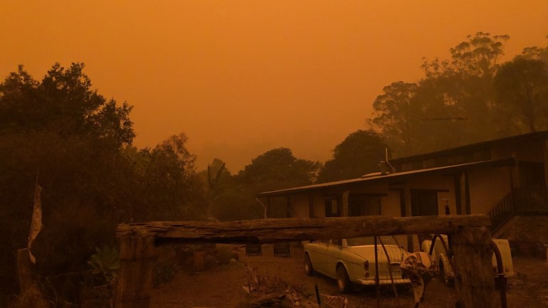 The sky turns orange as fires bear down on Cobargo 