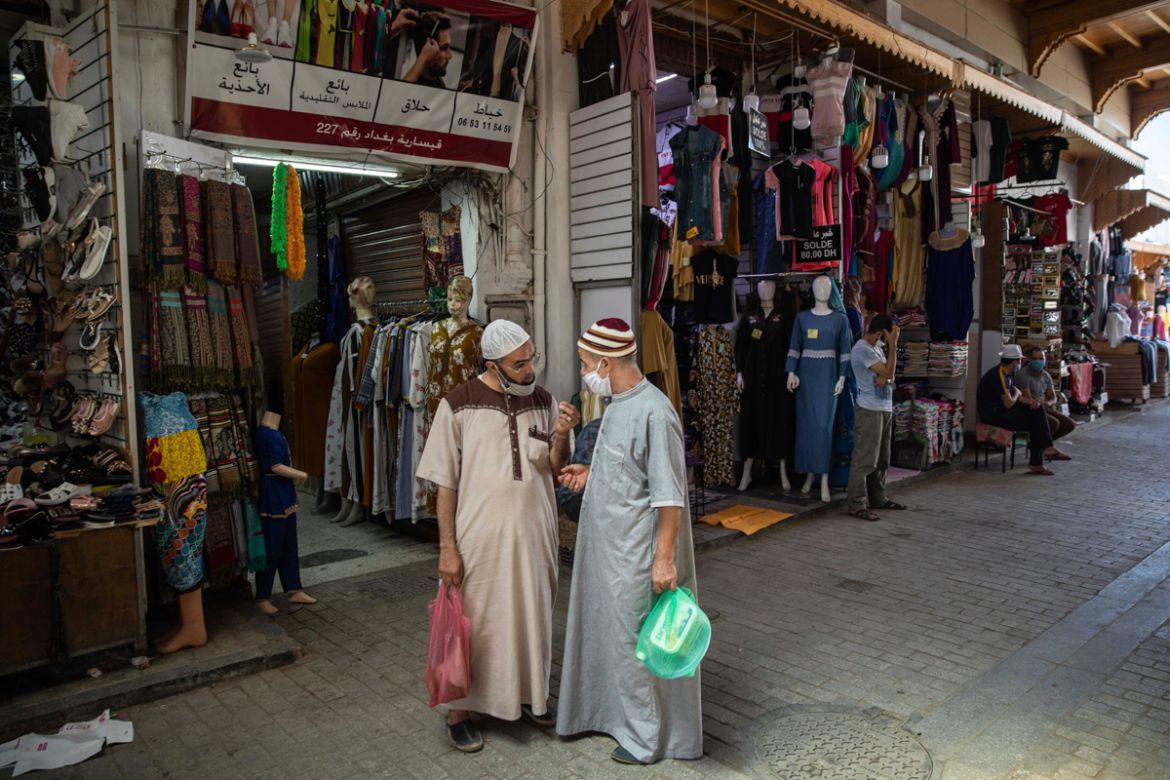 People wear face masks to prevent the spread of Coronavirus in the reopened Medina of Rabat after lockdown measures were lifted in Rabat, Morocco, Friday, June 26, 2020. Moroccans are re-experiencing