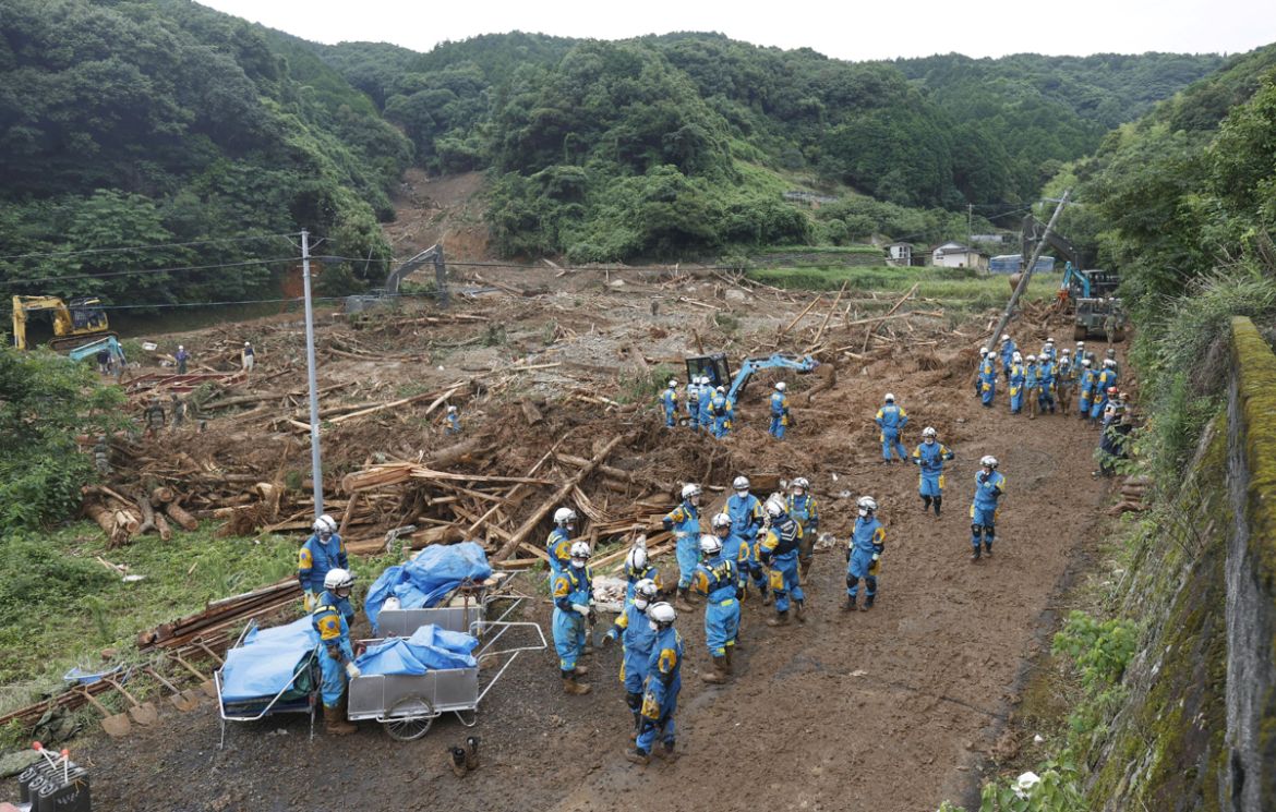 Police officers search for missing people at a landslide site caused by a heavy rain in Tsunagi town, Kumamoto prefecture, southern Japan, in this photo taken by Kyodo July 5, 2020. Mandatory credit K