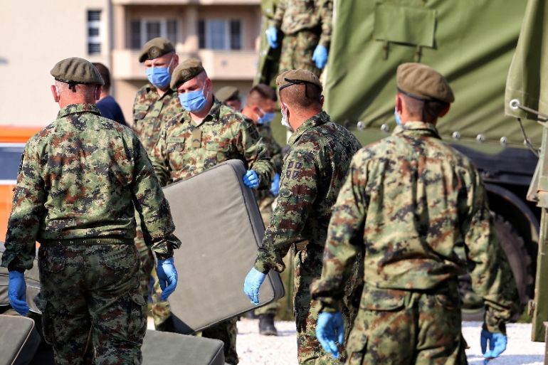 SERBIA-HEALTH-VIRUS Serbian army soldiers bring beds for a makeshift field hospital to accomodate patients in the city of Novi Pazar on July 3, 2020.