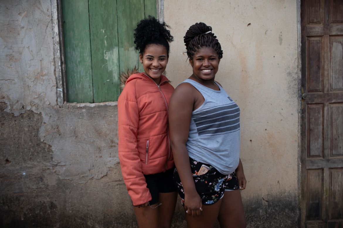 Sara Pompeu da Silva, left, and Ludmika Pompeu pose for a photo amid the new coronavirus pandemic at the Maria Joaquina "Quilombo" in Cabo Frio, on the outskirts of Rio de Janeiro, Brazil, Sunday, Jul