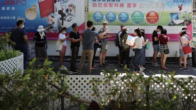 People queue to vote in the primaries organized by the pro-democracy movement for the 2020 Legislative Council elections, which were later postponed.