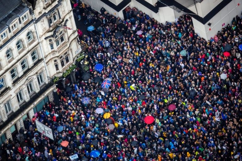 An aerial view shows part of the gathered crowd as Brexit accountability campaign group Led By Donkeys unfurls a large banner, as a spoof of the government''s advertising campaign,