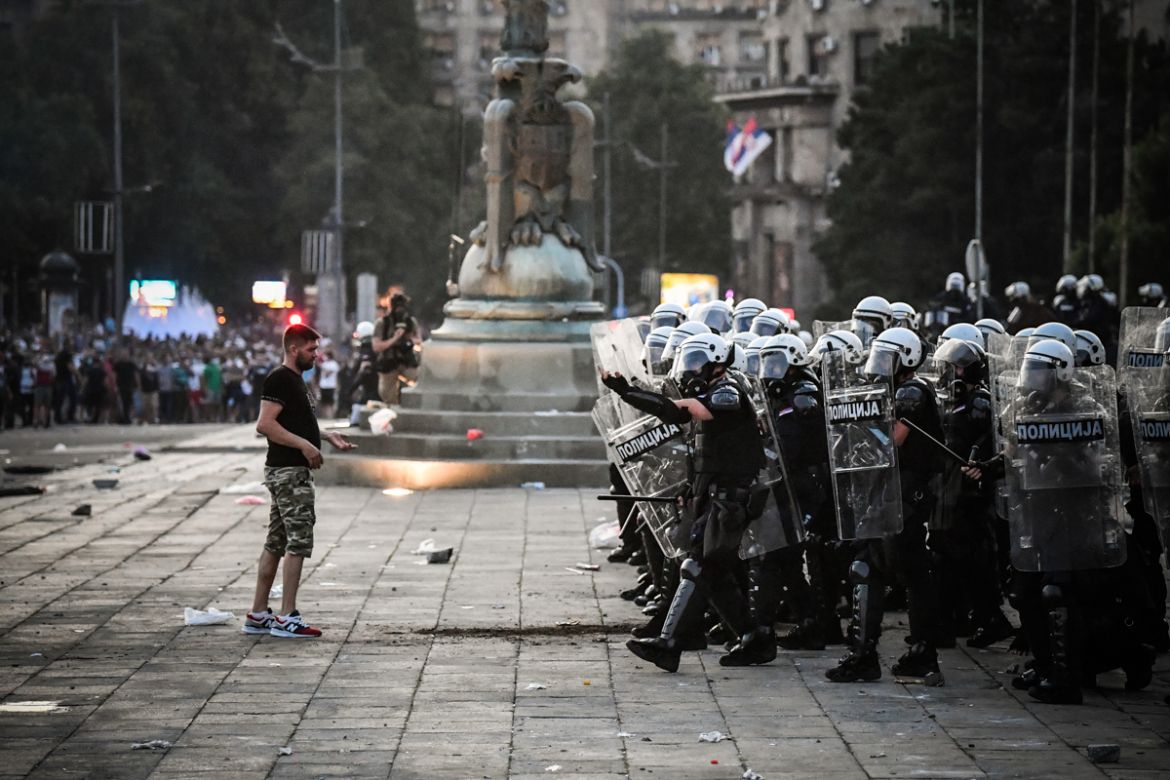 Protesters clash with police in front of Serbia''s National Assembly building in Belgrade on July 8, 2020 during a demonstration against a weekend curfew announced to combat a resurgence of COVID-19 in