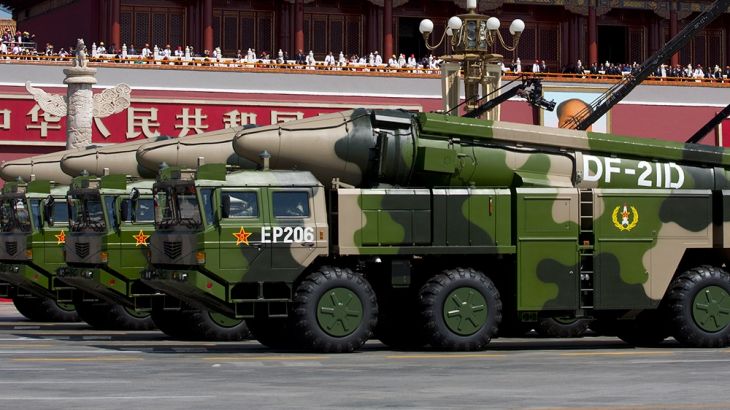 epa04910301 Chinese military vehicles carrying DF-21D anti-ship ballistic missiles drive past Tiananmen Gate during a military parade to commemorate the 70th anniversary of the end of World War II, in
