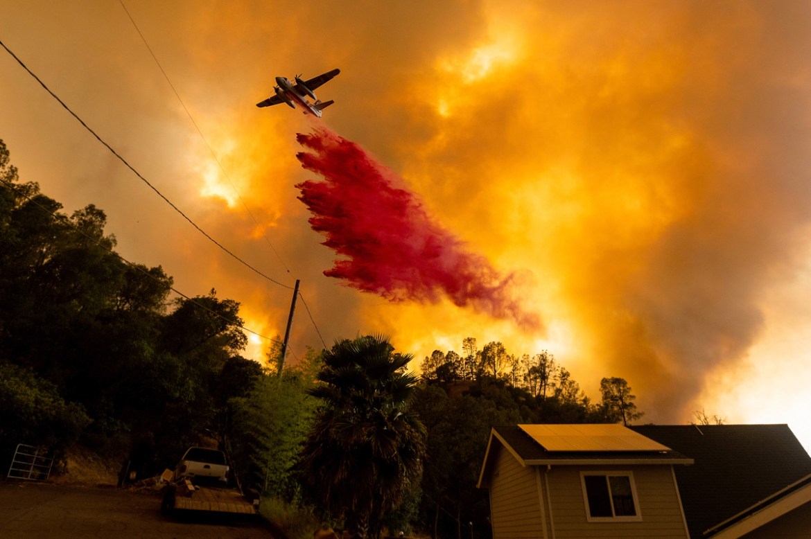 An air tanker drops retardant as the LNU Lightning Complex fires tear through the Spanish Flat community in unincorporated Napa County, Calif., Tuesday, Aug. 18, 2020. Fire crews across the region scr