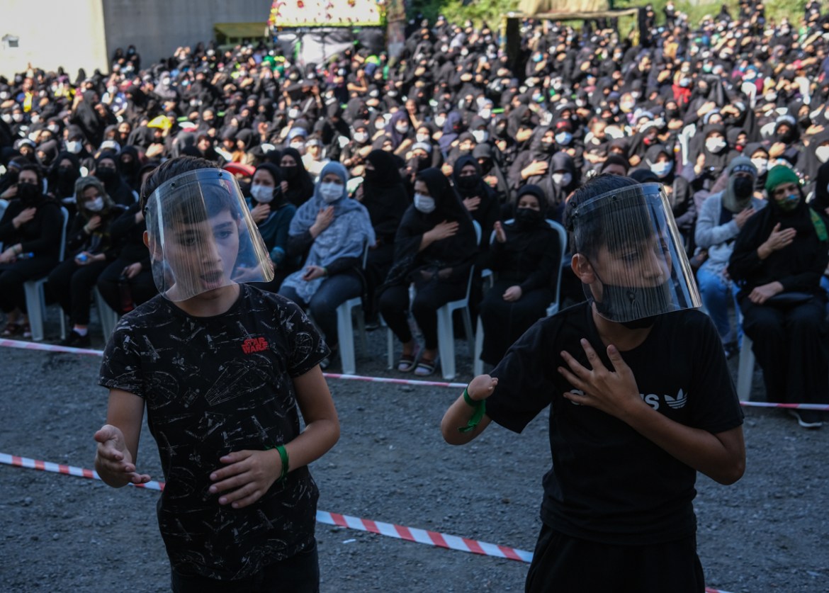 epa08633404 People wearing face masks attend the mourning ceremony, ahead of Ashura Day, in Istanbul, Turkey, 29 August 2020. Ashura day commemorates the death anniversary of the third Shiite Imam Hus