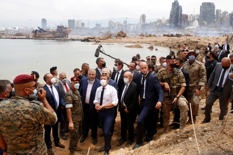 French President Emmanuel Macron visits the devastated site of the explosion at the port of Beirut, Lebanon August 6, 2020. Thibault Camus/Pool via REUTERS