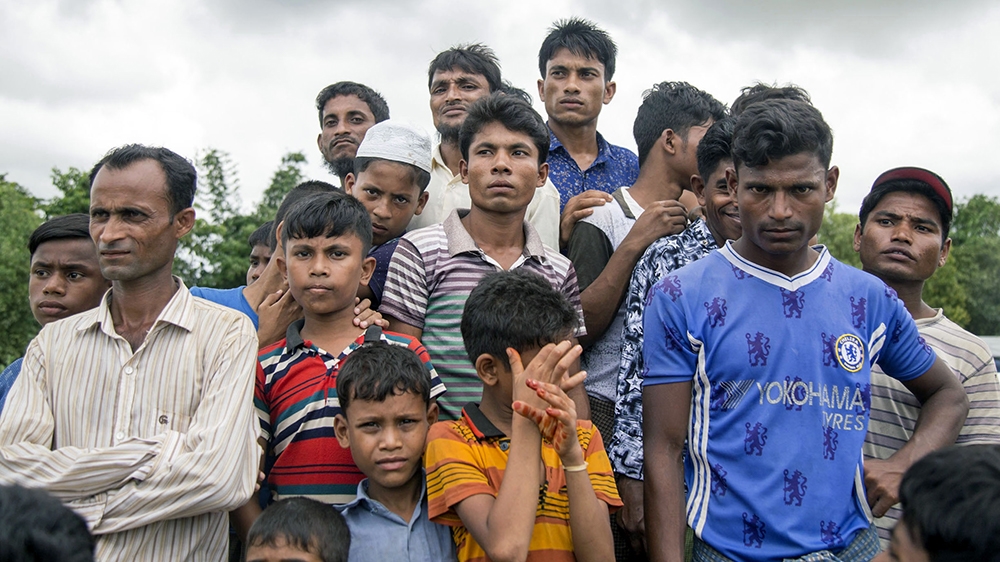 epa08423239 (FILE) - Rohingya refugees stands in front of UN and Bangladesh refugee commission office at Shalbagan repartition camp, during the repartition day in Teknuf, Cox's Bazar, Bangladesh, 22 A