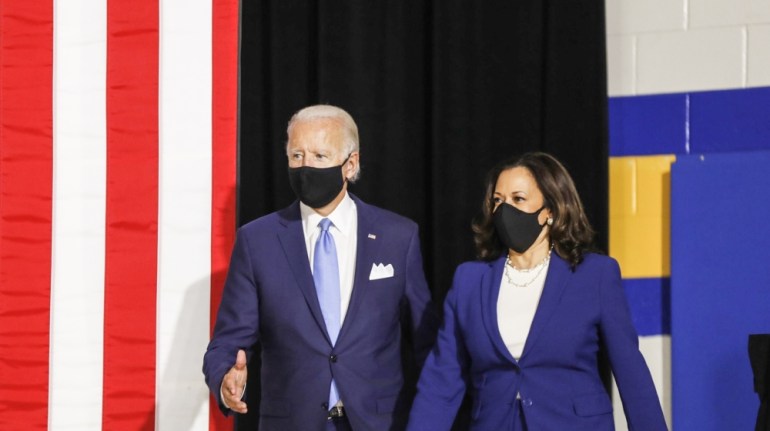 Former Vice President Joe Biden, presumptive Democratic presidential nominee, left, and Senator Kamala Harris, presumptive Democratic vice presidential nominee, wear protective masks while arriving to
