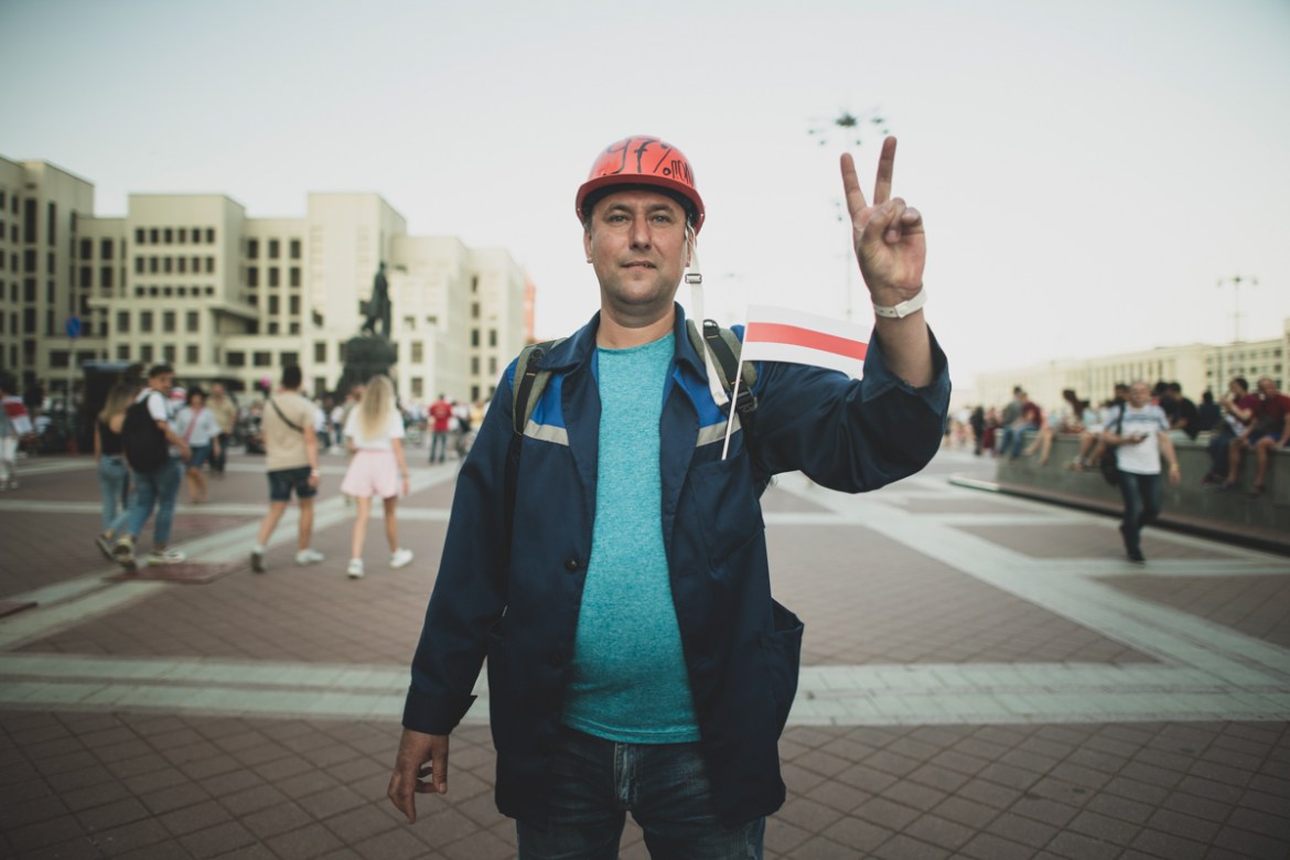 Pavel Stavpinskiy, 43, a worker who was an election observer during the last presidential election poses for a photo during an opposition rally in Independence Square in Minsk, Belarus, Monday, Aug. 1
