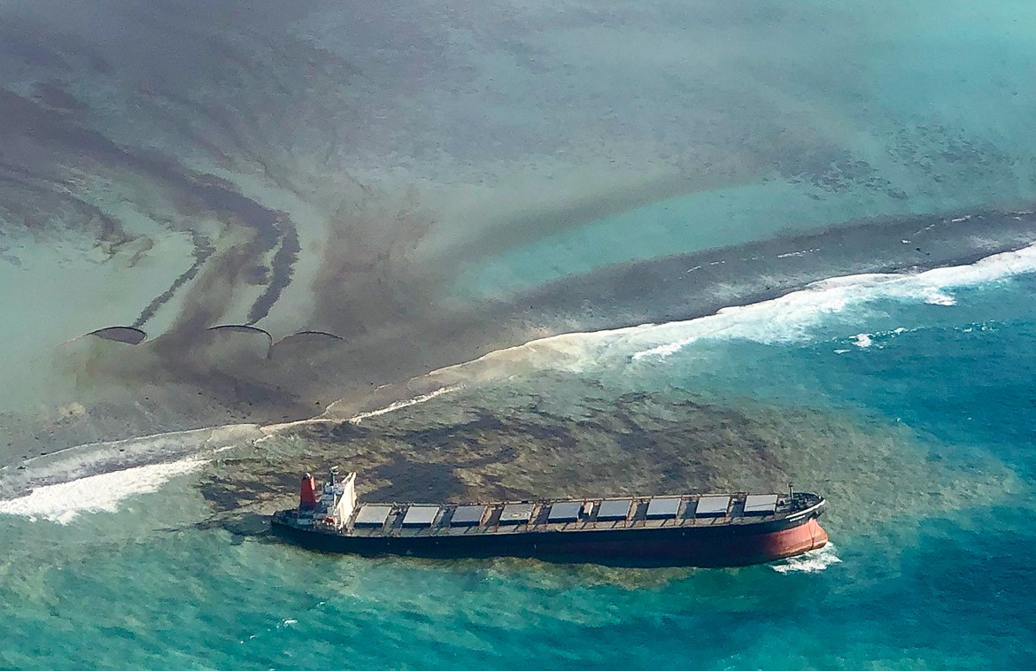 This photo taken and provided by Eric Villars shows oil leaking from the MV Wakashio, a bulk carrier ship that recently ran aground off the southeast coast of Mauritius, Friday, Aug. 7, 2020. Anxious