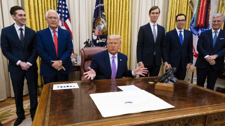 U.S. President Donald Trump, center, speaks during a meeting in the Oval Office of the White House in Washington, D.C., U.S., on Thursday, Aug. 13, 2020. Israel and the United Arab Emirates reached an