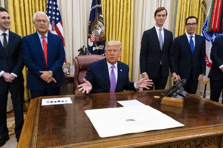 U.S. President Donald Trump, center, speaks during a meeting in the Oval Office of the White House in Washington, D.C., U.S., on Thursday, Aug. 13, 2020. Israel and the United Arab Emirates reached an
