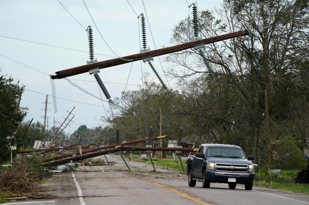Downed power lines are seen on Highway 90 after Hurricane Laura passed through Iowa, Louisiana, U.S. August 27, 2020. REUTERS/Elijah Nouvelage