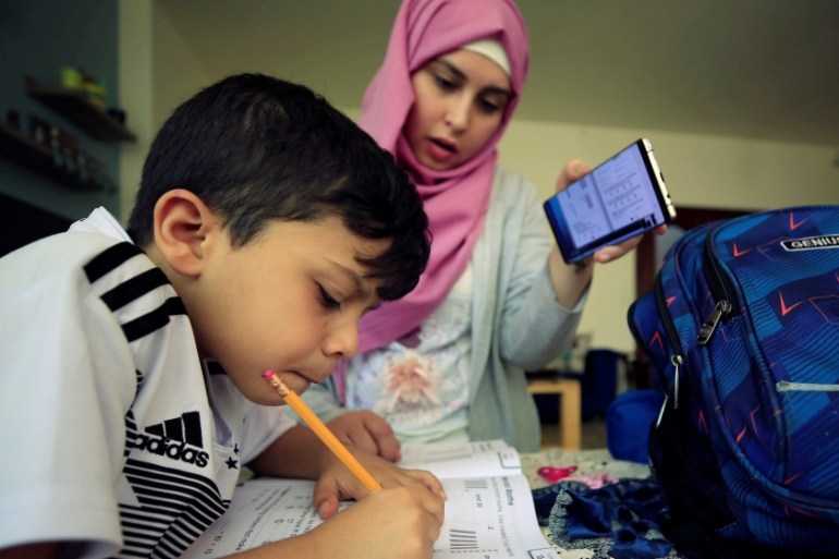 A young student studies online at home in Sidon, Lebanon