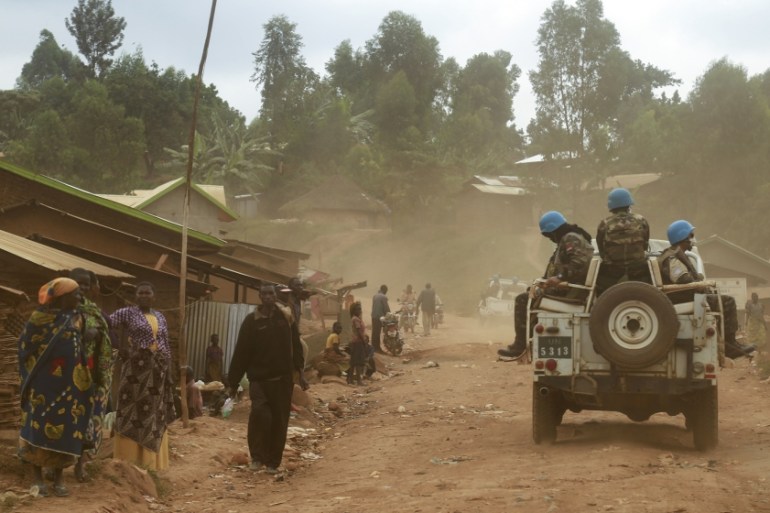 In this photograph taken on March 13, 2020, Moroccan soldiers from the UN mission in DRC (Monusco) ride in a vehicle as they patrol in the violence-torn Djugu territory, Ituri province, eastern DRCong