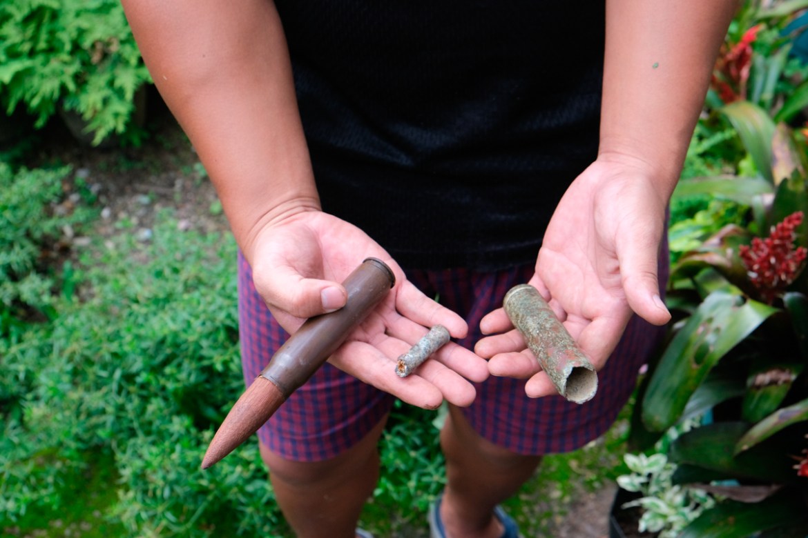 An Angami Naga boy Viketouzo Miachieo, 22, displays ammunition from World War II that he found a few years ago while cleaning the area beside his house in Kohima village, in the northeastern Indian st