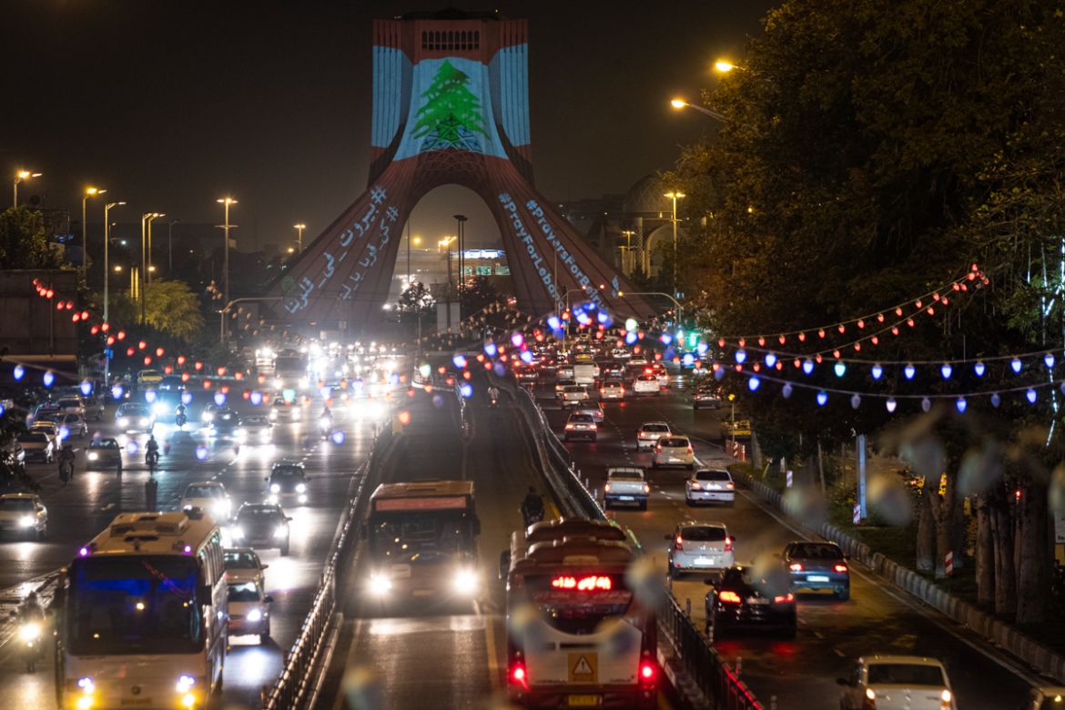 The video mapping is projected on the Azadi (Freedom) Monument in western Tehran, on August 5, 2020. A Lebanon flag projected on the Monument as a sign of unity between Iran and the Lebanon also a sym