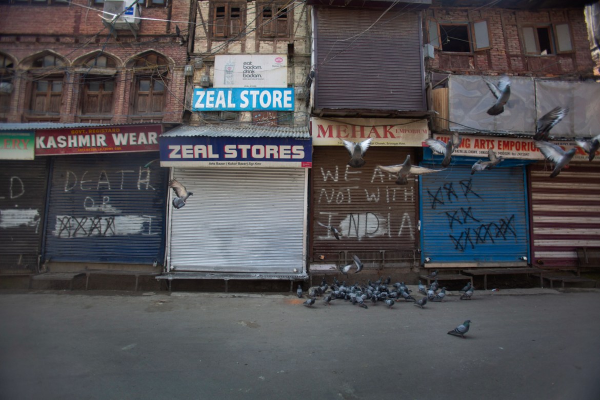 Pigeons fly at a deserted market area during lockdown to stop the spread of the coronavirus in Srinagar, Indian controlled Kashmir, July 22, 2020. Indian-controlled Kashmir''s economy is yet to recove