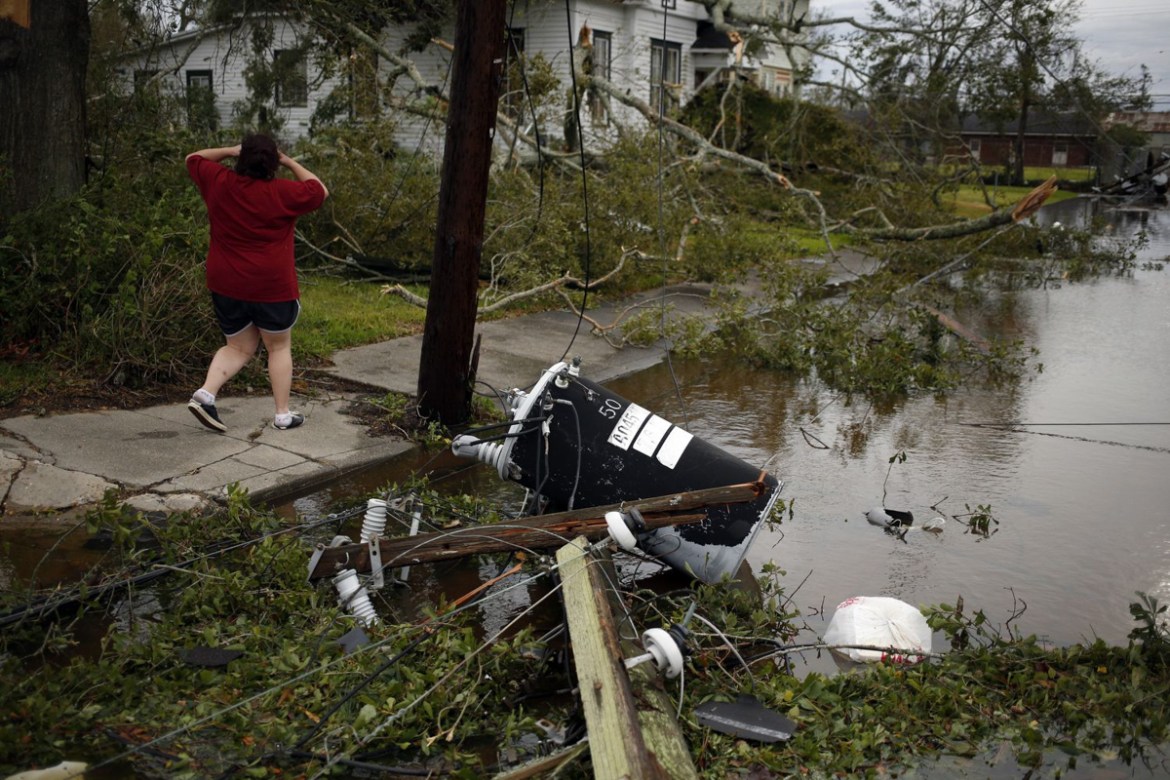 A resident surveys damage inflicted after Hurricane Laura made landfall in Lake Charles, Louisiana, U.S., on Thursday, Aug. 27, 2020. Hurricane Laura raked across Louisiana early on Thursday, becoming