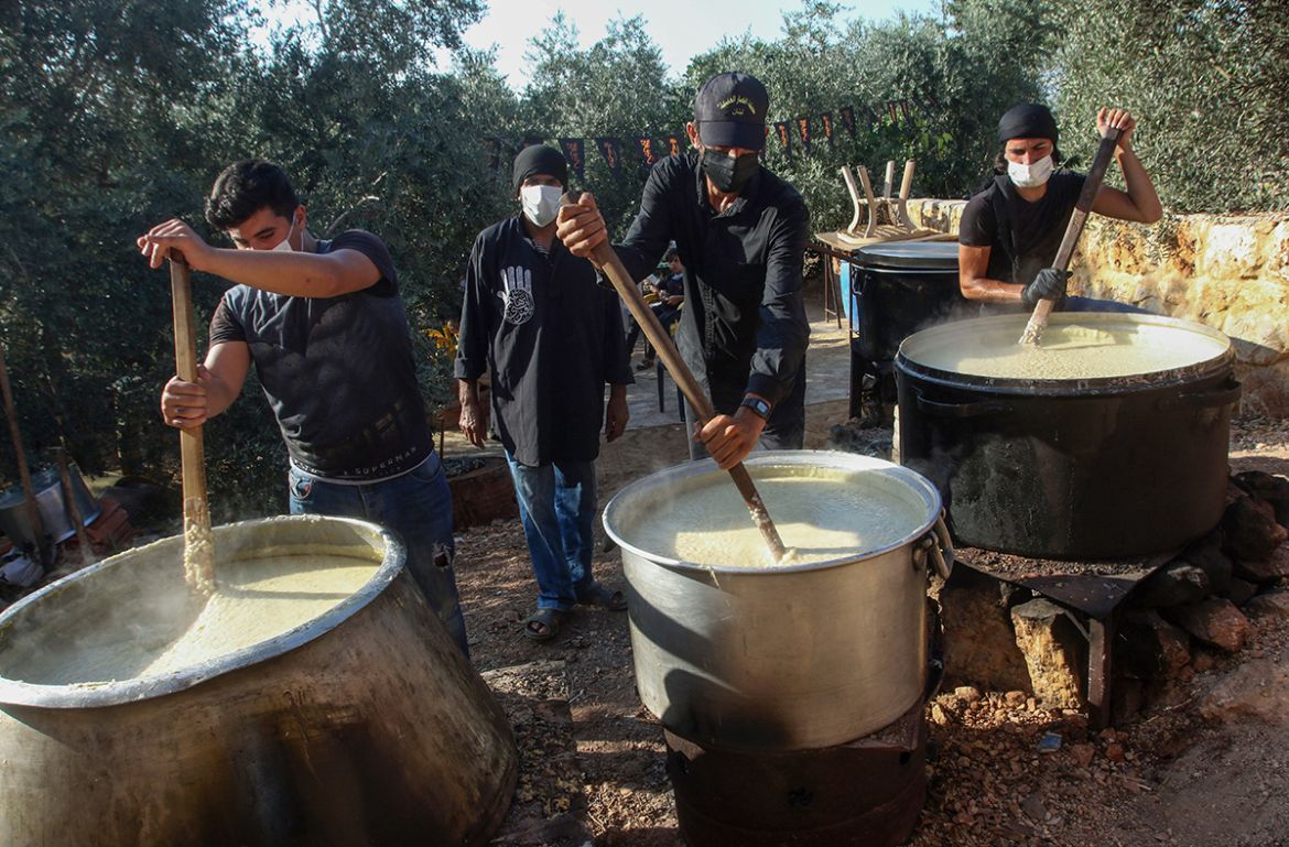 Lebanese Shiite Muslims cook Harissah, a traditional dish made to distribute to the poor during the commemoration of the martyrdom of Prophet Mohammad''s grandson Imam Hussein in the Islamic month of M