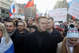 Russian opposition leader Alexey Navalny and his wife Yulia take part in a rally to mark the 5th anniversary of Boris Nemtsov's murder in Moscow on February 29, 2020 [File: Reuters/Shamil Zhumatov]
