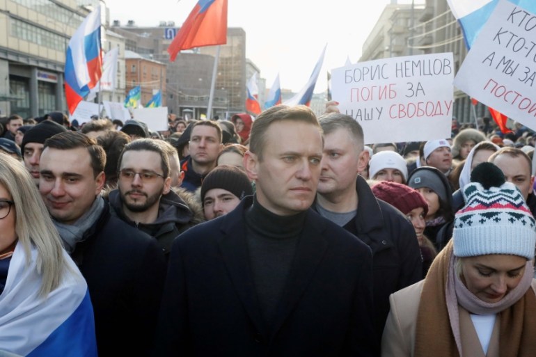 Russian opposition politician Alexei Navalny, his wife Yulia and opposition figure Lyubov Sobol take part in a rally to mark the 5th anniversary of opposition politician Boris Nemtsov''s murder