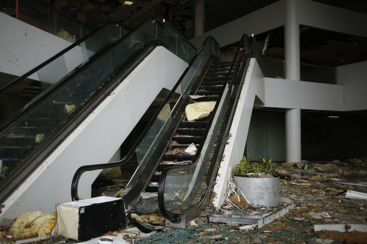 Escalators in an office building lobby damaged after Hurricane Laura made landfall in Lake Charles, Louisiana, U.S., on Thursday, Aug. 27, 2020. Hurricane Laura raked across Louisiana early on Thursda