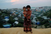 Rohingya refugee children pose for a picture at the Balukhali camp in Cox's Bazar, Bangladesh, November 15, 2018 [Mohammad Ponir Hossain/Reuters] 