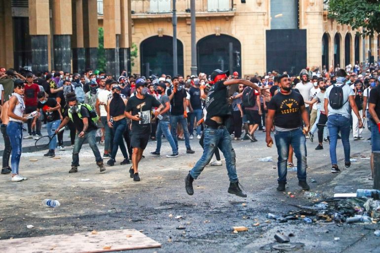 Demonstrators throw rocks during a protest following Tuesday''s blast, in Beirut, Lebanon August 9, 2020. REUTERS/Hannah McKay