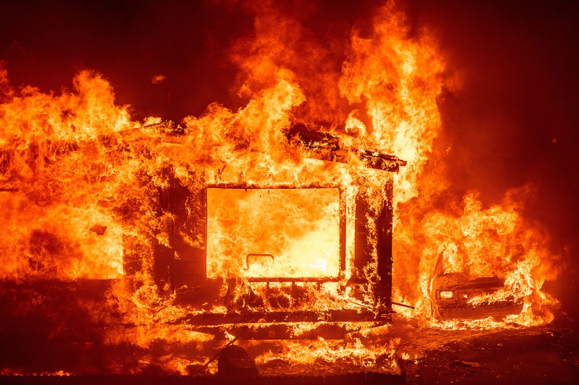 A mobile home and car burn at Spanish Flat Mobile Villa as the LNU Lightning Complex fires tear through unincorporated Napa County, Calif., on Tuesday, Aug. 18, 2020. Fire crews across the region scra