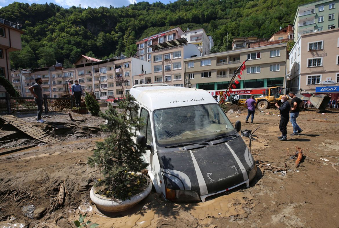 People inspect the destruction after floods caused by heavy rain in the mountain town of Dereli in Giresun province, along Turkey''s Black Sea coastline, Sunday, Aug. 23, 2020. Interior Minister Suley