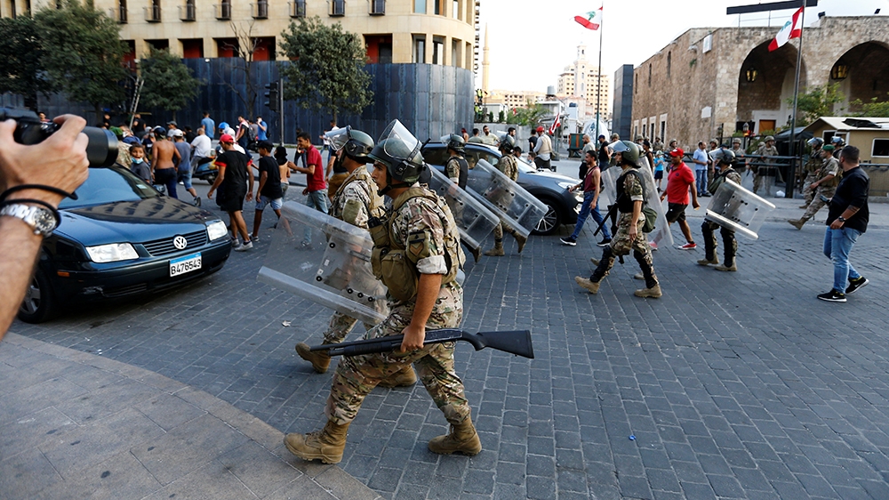 Lebanese Army soldiers are deployed during a protest in the aftermath of a blast, in Beirut, Lebanon, August 12, 2020. REUTERS/Thaier Al-Sudani