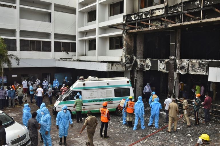 Rescue workers look for survivors after a fire broke out in a hotel that was being used as a coronavirus disease (COVID-19) facility in Vijayawada, in the southern state of Andhra Pradesh, India, Augu