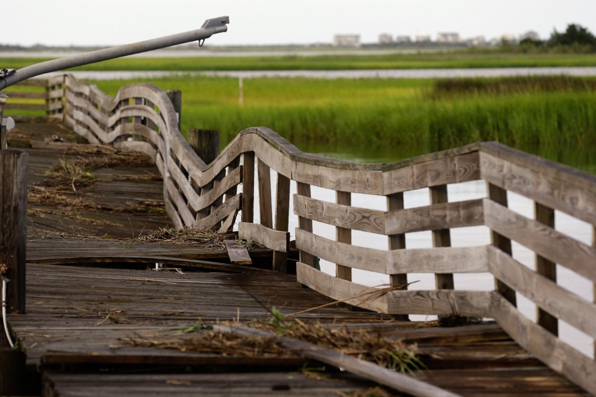 A pier shows damages following the effects of Hurricane Isaias in Southport, N.C., Tuesday, Aug. 4, 2020. (AP Photo/Gerry Broome)