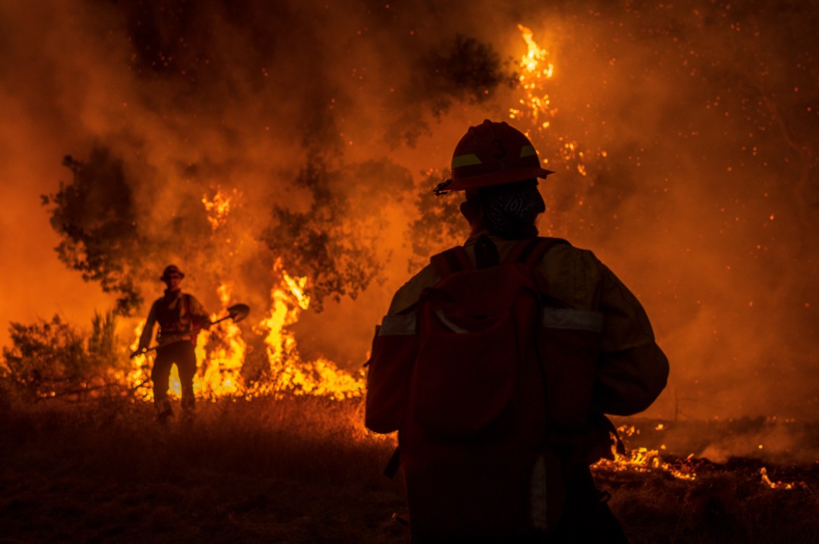 Members of the Grizzly Firefighters fight the Carmel Fire near Carmel Valley, Calif., Tuesday, Aug. 18, 2020. (AP Photo/Nic Coury)