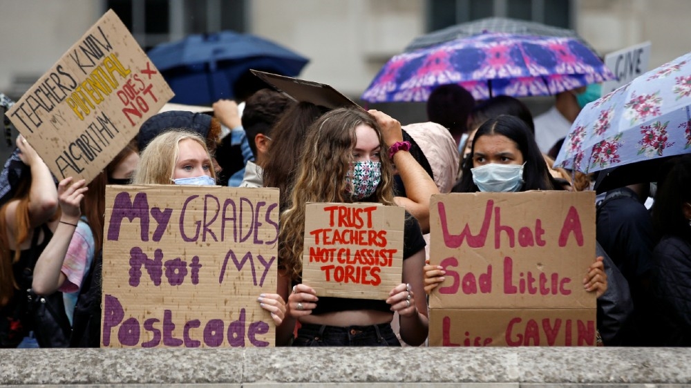 A level students hold placards as they protest opposite Downing Street, amid the outbreak of the coronavirus disease (COVID-19), in London, Britain, August 16, 2020. REUTERS/Henry Nicholls/File Photo