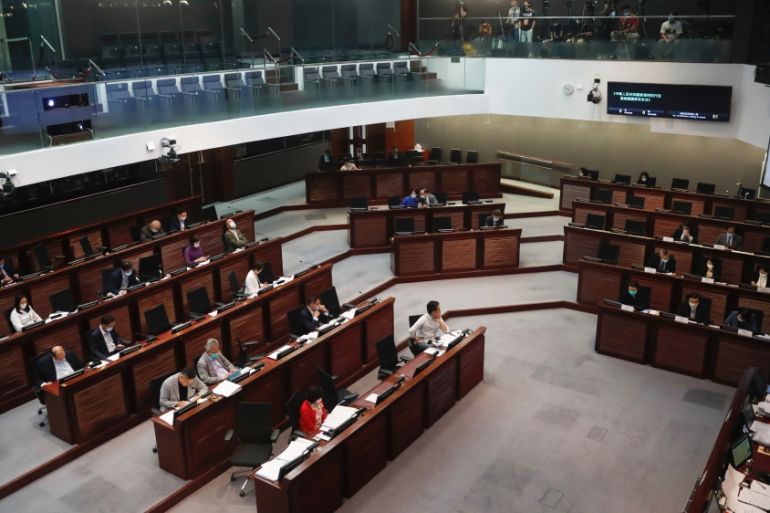 Legislators attend a meeting to debate national security law at Legislative Council, in Hong Kong