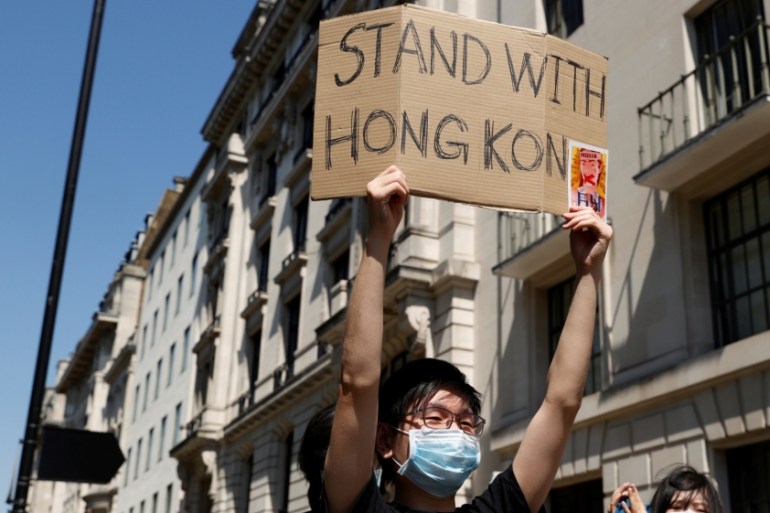 Pro-democracy demonstrators protest Hong Kong''s deteriorating freedoms outside China''s embassy, in London