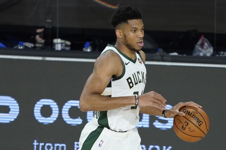 Milwaukee Bucks'' Giannis Antetokounmpo drives up court during the second half of an NBA basketball first round playoff game against the Orlando Magic Monday, Aug. 24, 2020, in Lake Buena Vista, Fla. (