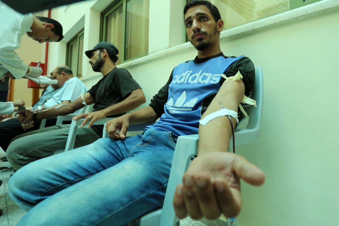 Palestinians donate bloods, in Gaza, Palestine, on August 5, 2020 during a public blood donation campaign for the lebanese community following the explosion at Beirut port. (Photo by Majdi Fathi/NurPh