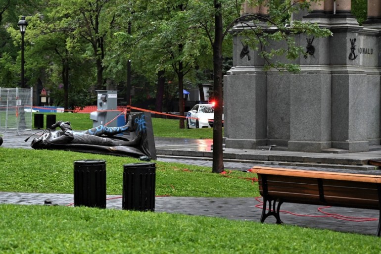 A statue of the first Canadian Prime Minister John A. Macdonald lies on the ground, with the statue''s head a few meters away, at Canada Park in central Montreal on August 29, 2020, after it was pulled