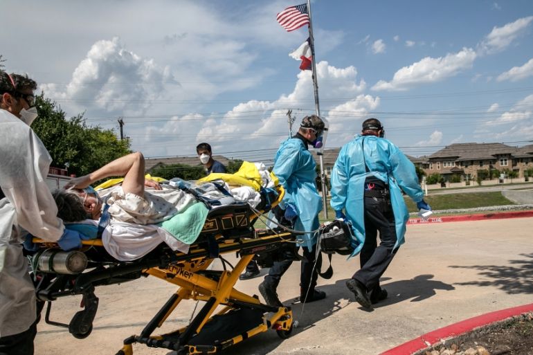 Medics with Austin-Travis County EMS transport a nursing home resident with coronavirus symptoms on August 03, 2020 in Austin, Texas. Texas has had the third-highest number of COVID-19 cases in the Un