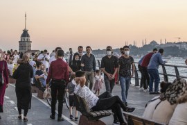 People enjoy themselves near the Bosphorus on sunset in Istanbul, Turkey, 23 August 2020. Turkish authorities have now allowed the reopening of restaurants, cafes, parks and beaches, as well as liftin
